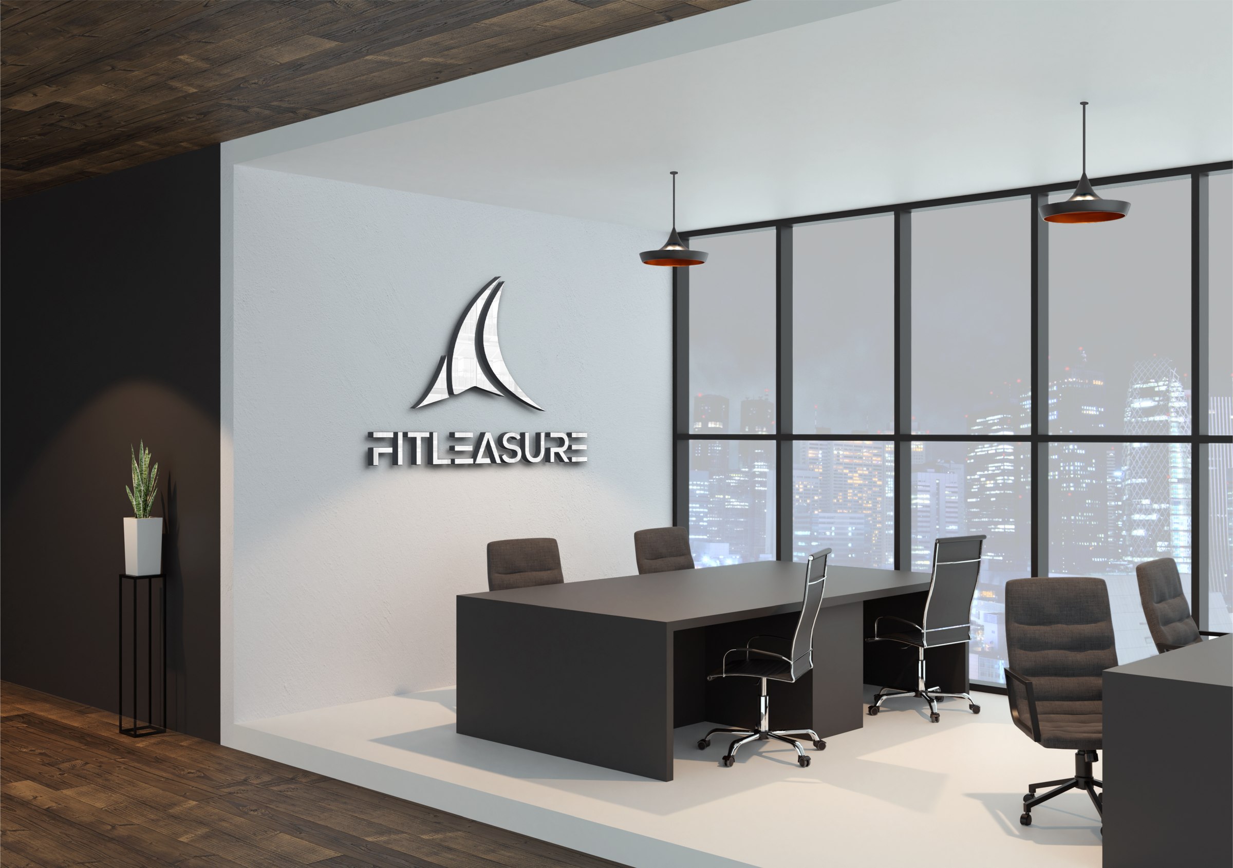 Fitleasure logo signage in an office meeting room